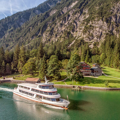 The Gaisalm mountain hut is a beautiful place to stop by when hiking on the Mariensteig path from Achenkirch to Pertisau. This photo shows one of the Achensee ships leaving the jetty.