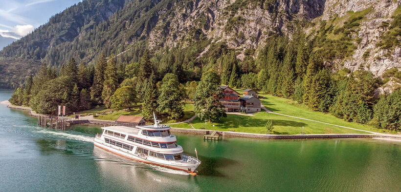 The Gaisalm mountain hut is a beautiful place to stop by when hiking on the Mariensteig path from Achenkirch to Pertisau. This photo shows one of the Achensee ships leaving the jetty.