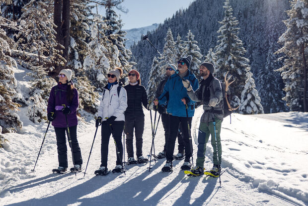 Snowshoeing in the Nature Park Karwendel A group enjoys a beautiful winter's day while exploring the region on a guided snowshoe tour.