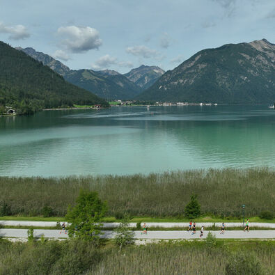Participants traverse the picturesque Achensee Run course while enjoying a scenic vista of the lake.