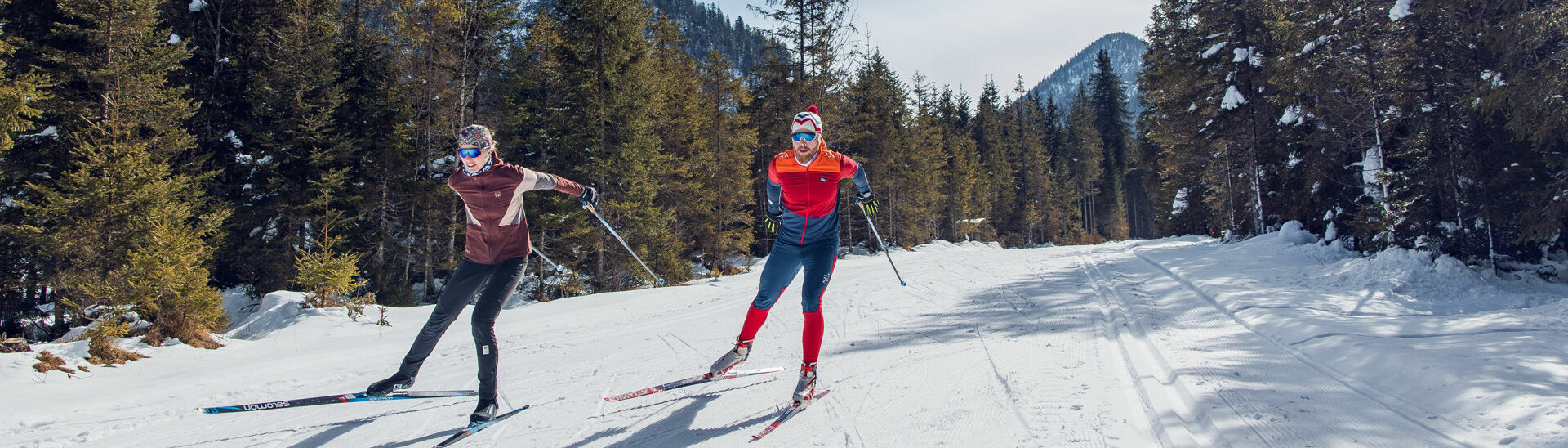 Cross-country skiing in Steinberg am Rofan A couple enjoys cross-country skiing in Steinberg am Rofan surrounded by snowy landscapes.}